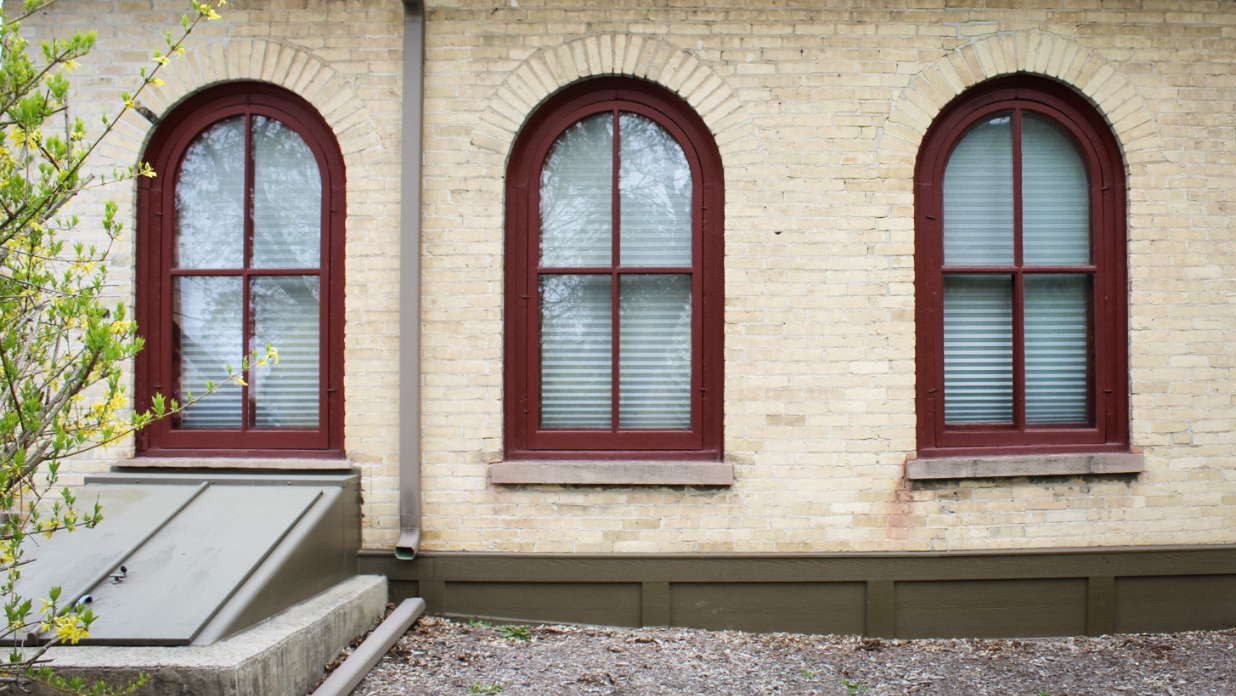 Historic wood windows of the 1865 Frisby-Wagner House of The Tower Heritage Center in West Bend, WI
